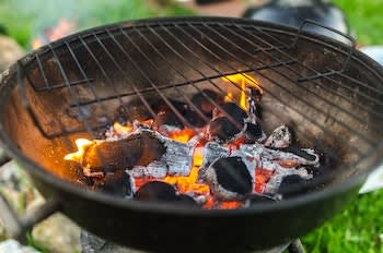 burning coals in grill